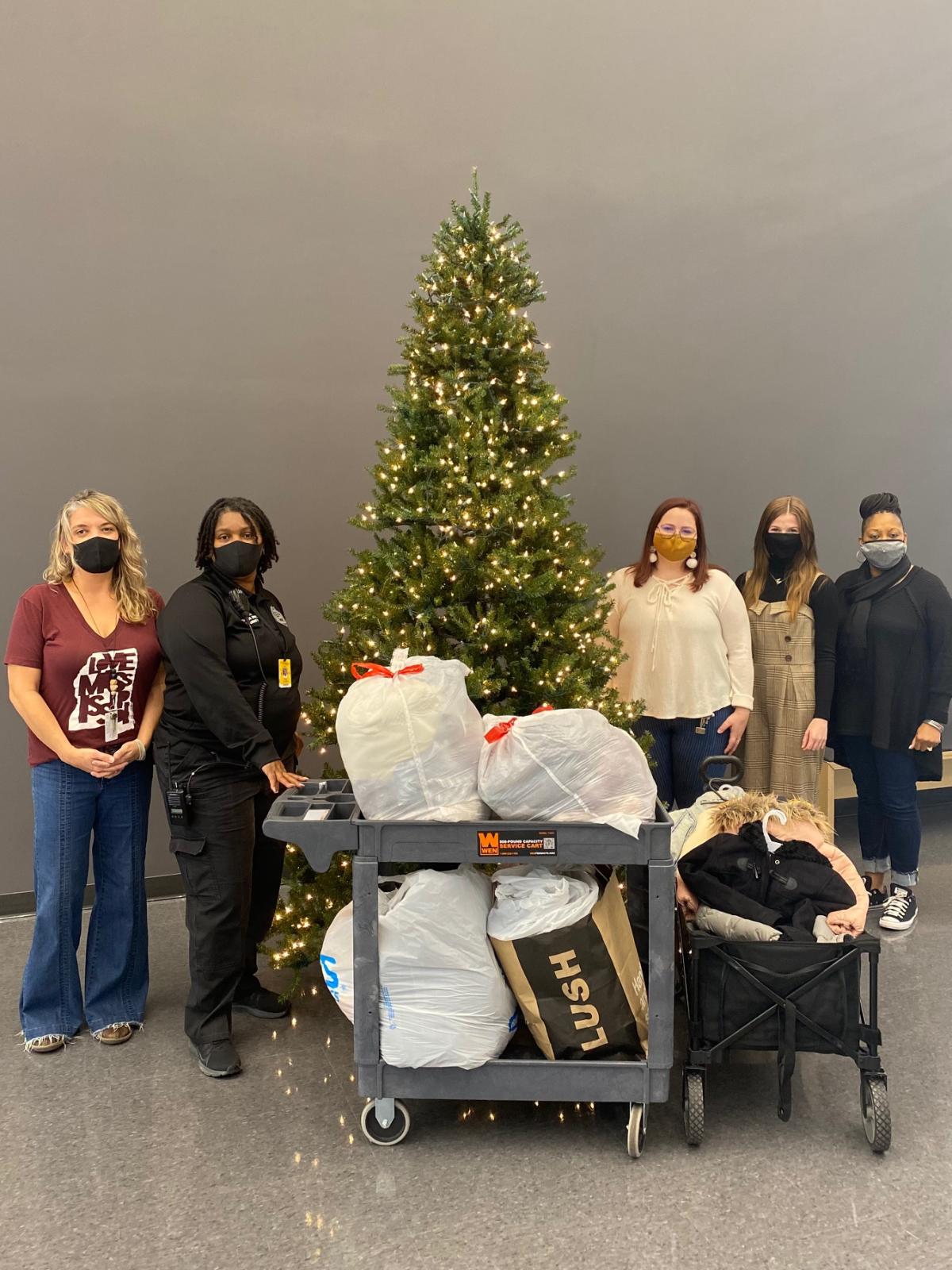 AEMS Students delivering coats to Partnership staff at middle school