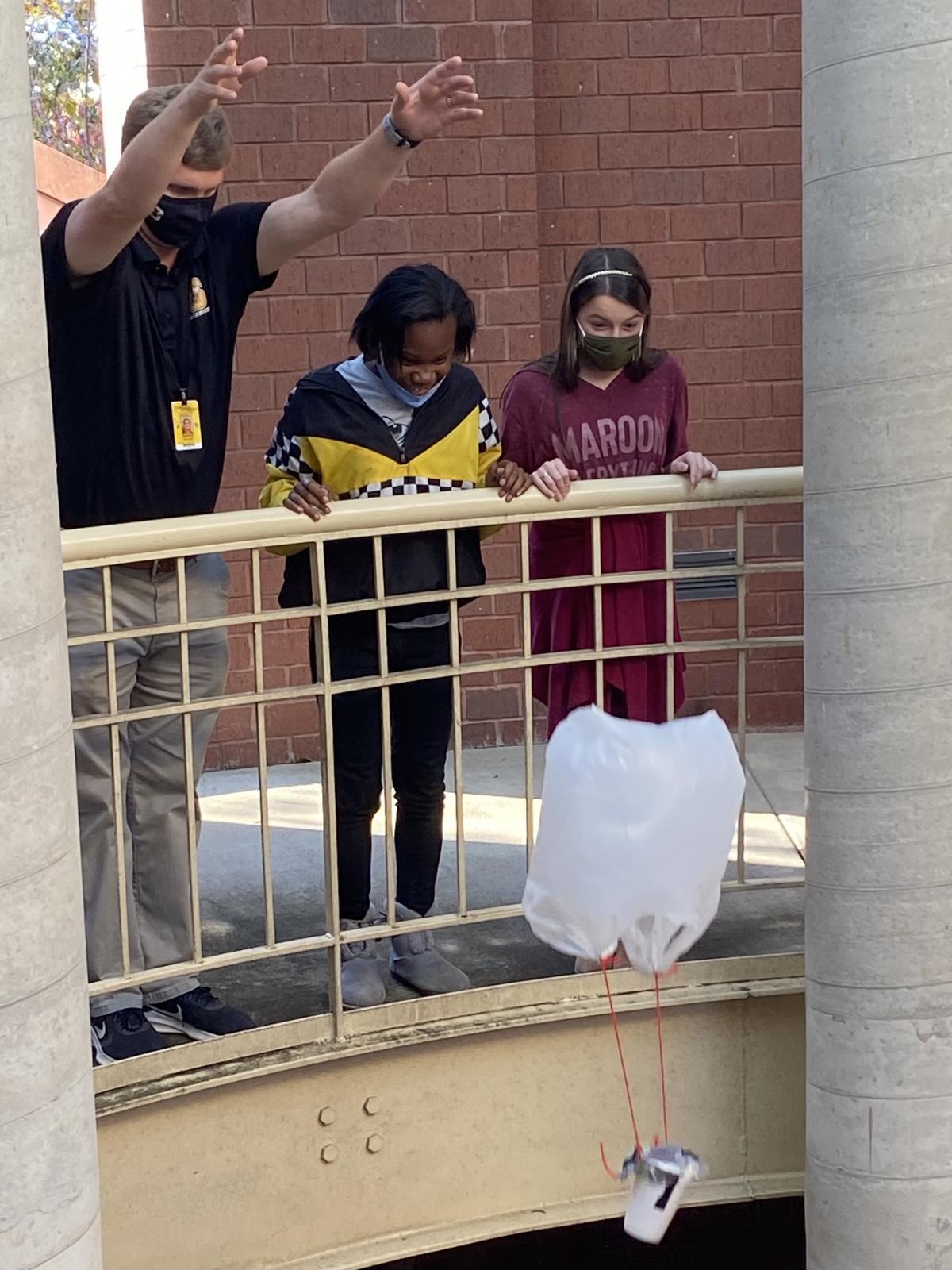 Teacher and two students drop egg at MSU SSRC
